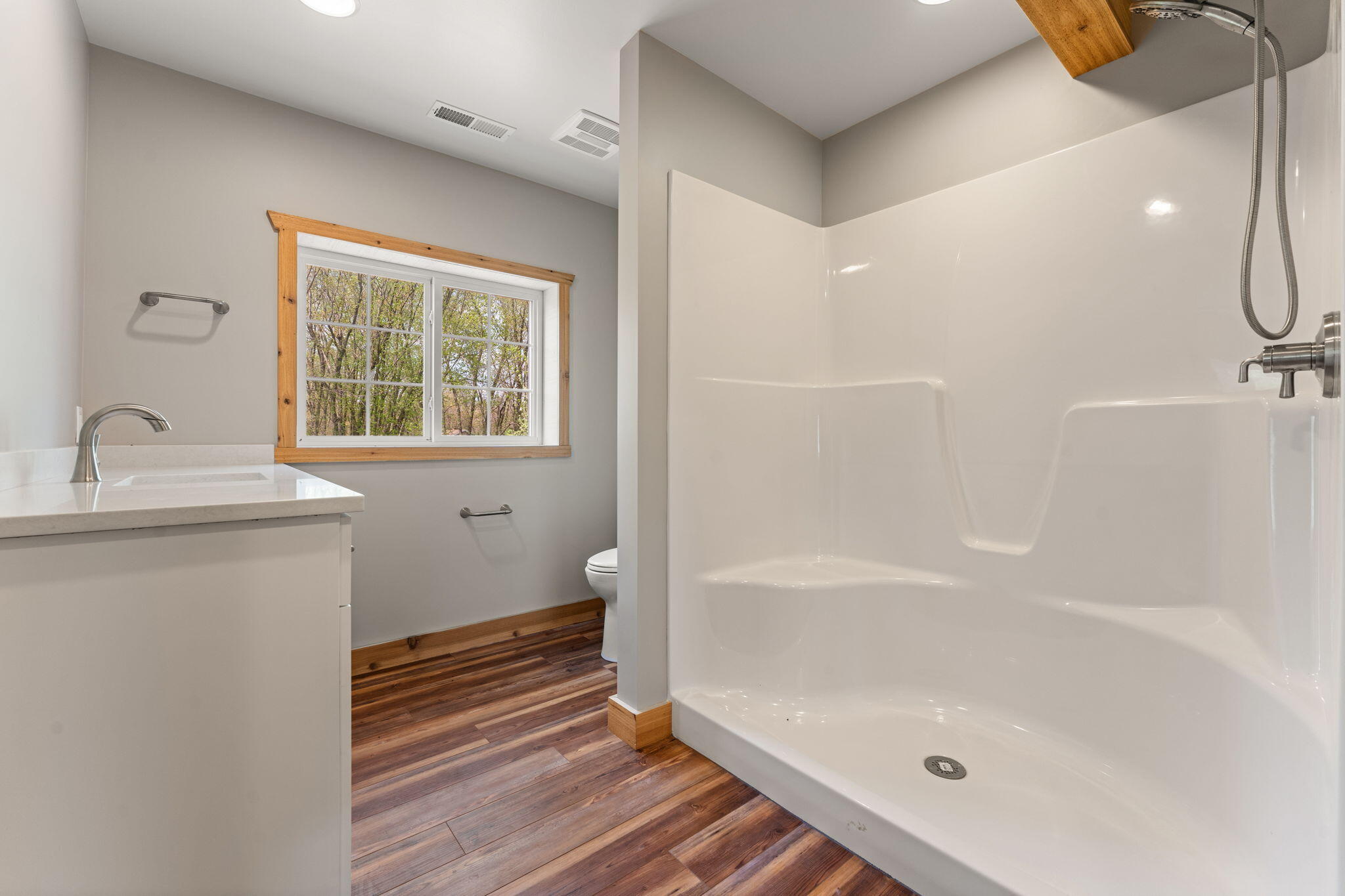 6631 Beach Street Knox, IN 46534 - Photo 24 of 41 a bathroom with a granite countertop sink a toilet and shower