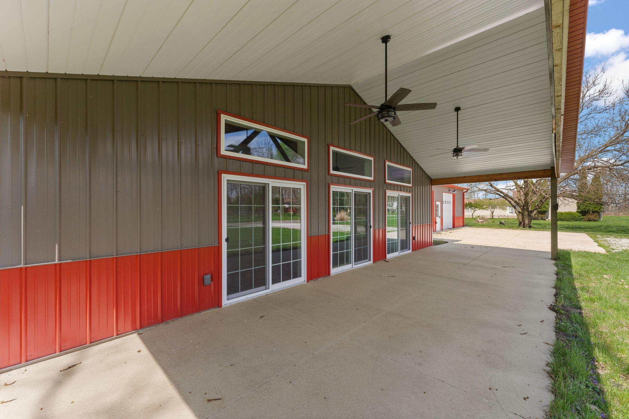 6631 Beach Street Knox, IN 46534 - Photo 35 of 41 a view of a house with a floor to ceiling windows and a ceiling fan