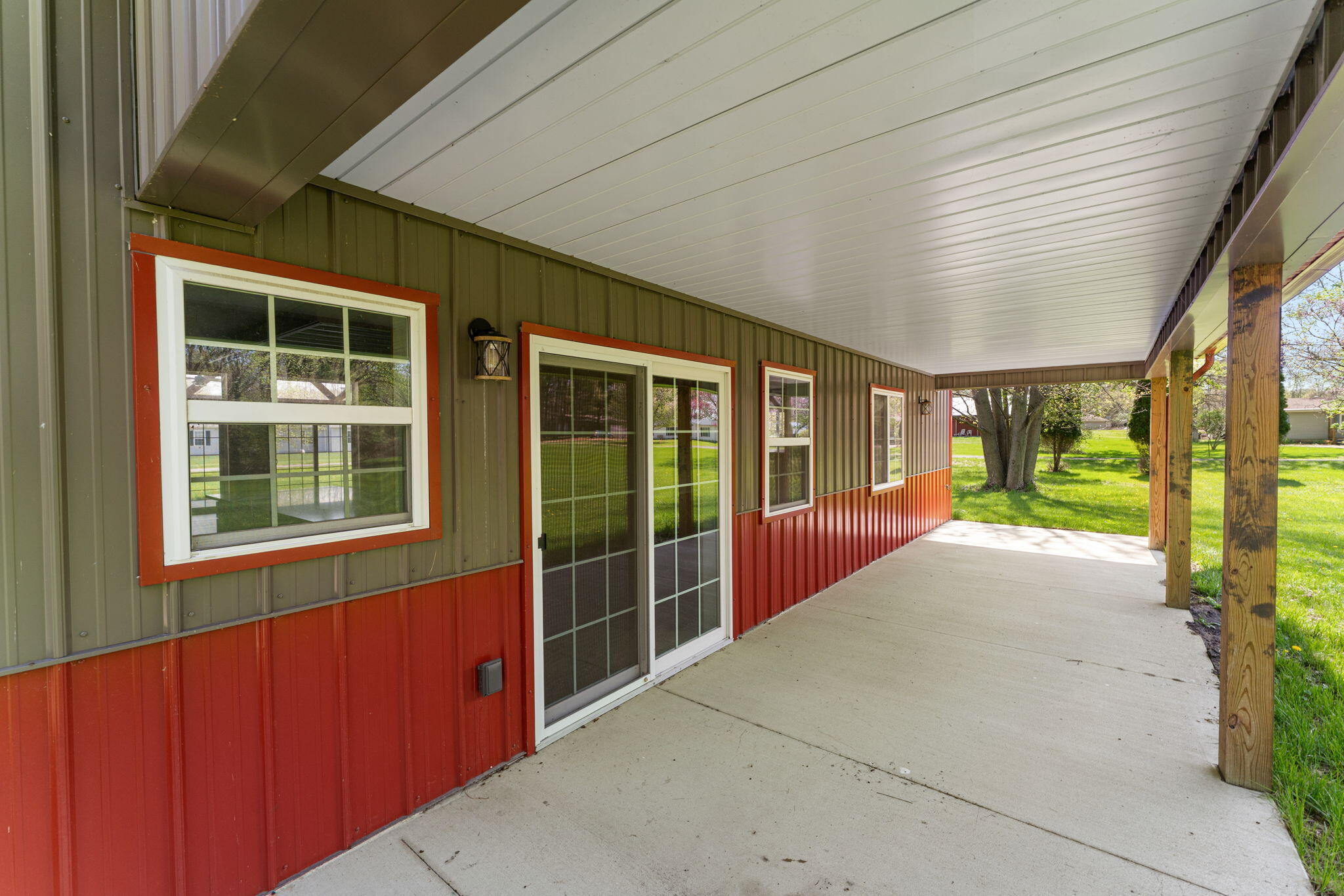 6631 Beach Street Knox, IN 46534 - Photo 38 of 41 a view of porch with a floor to ceiling window and wooden floor