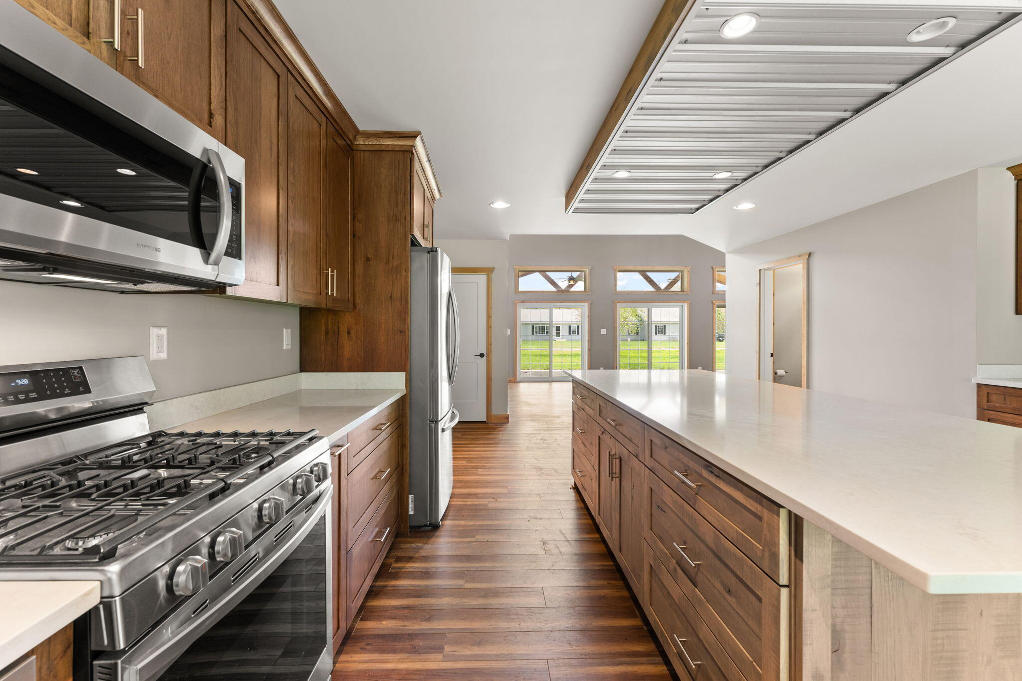6631 Beach Street Knox, IN 46534 - Photo 10 of 41 a kitchen with stainless steel appliances granite countertop a stove and a sink