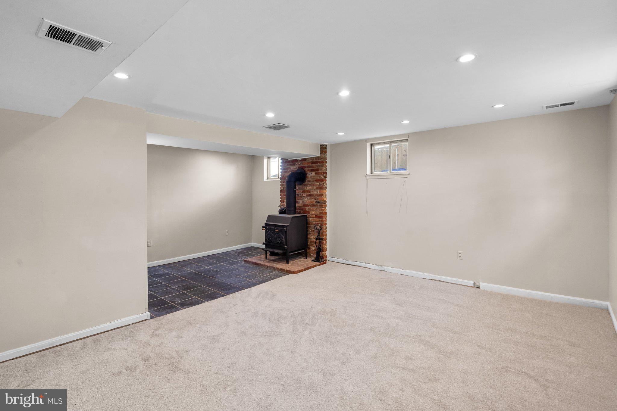 12840 Littleton Street Silver Spring, MD 20906 - Photo 21 of 33 Lower Level Family Room with Wood Stove