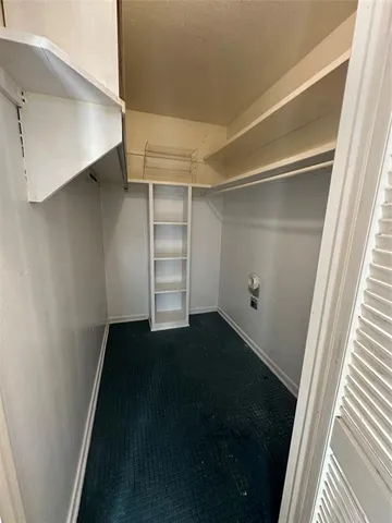 a view of an empty walk in closet