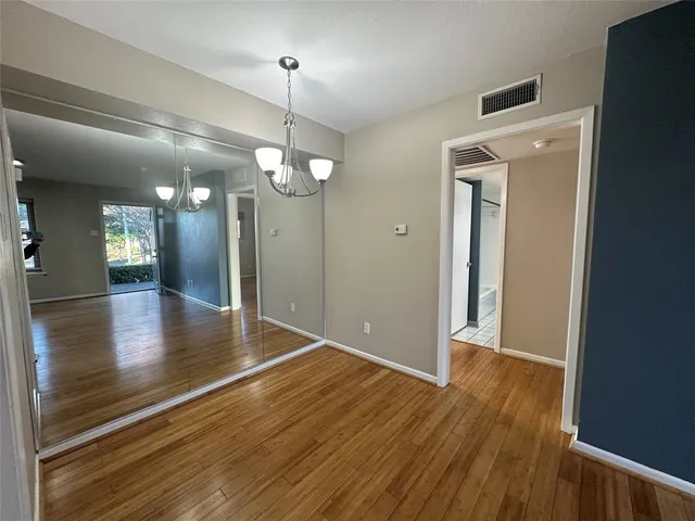 a view of a livingroom with wooden floor