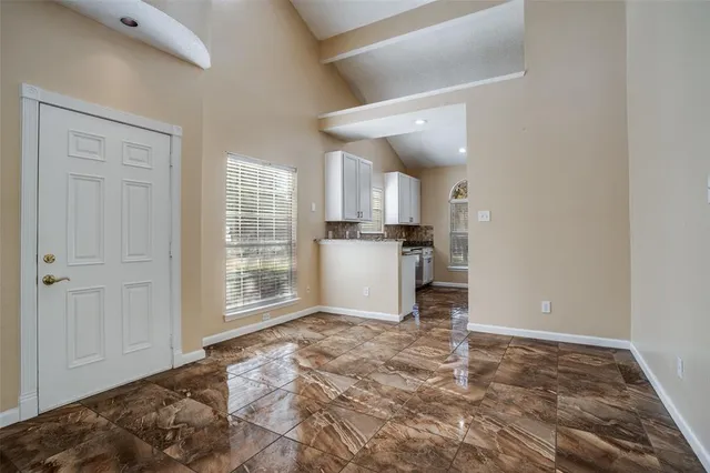 a view of a kitchen with a sink and dishwasher cabinets