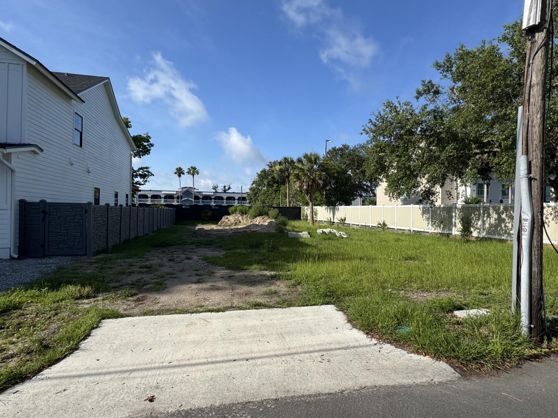 a view of backyard with green space