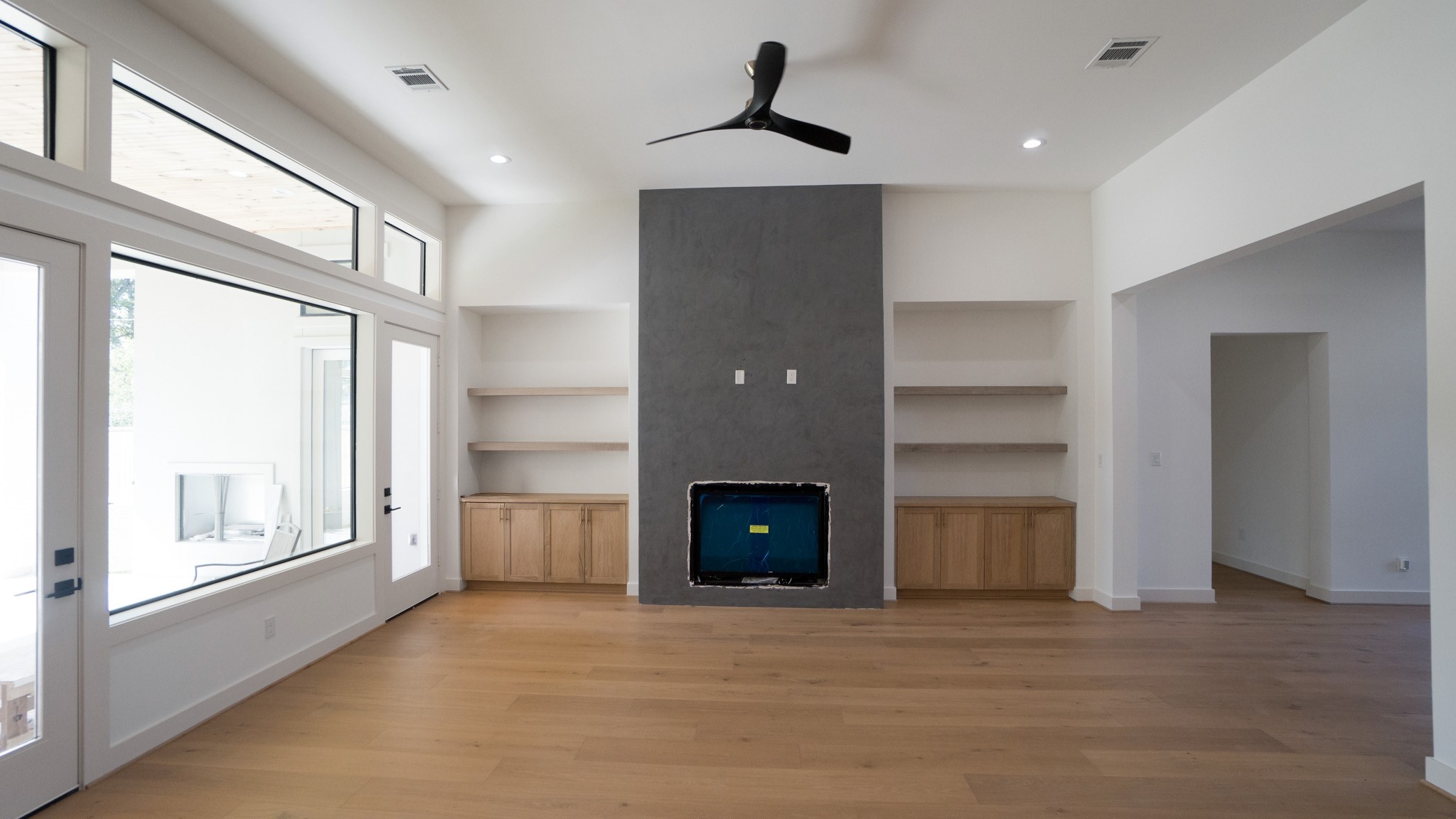 1731 Benbow Way Houston, TX 77080 - Photo 13 of 15 a view of an empty room with a fireplace and a window