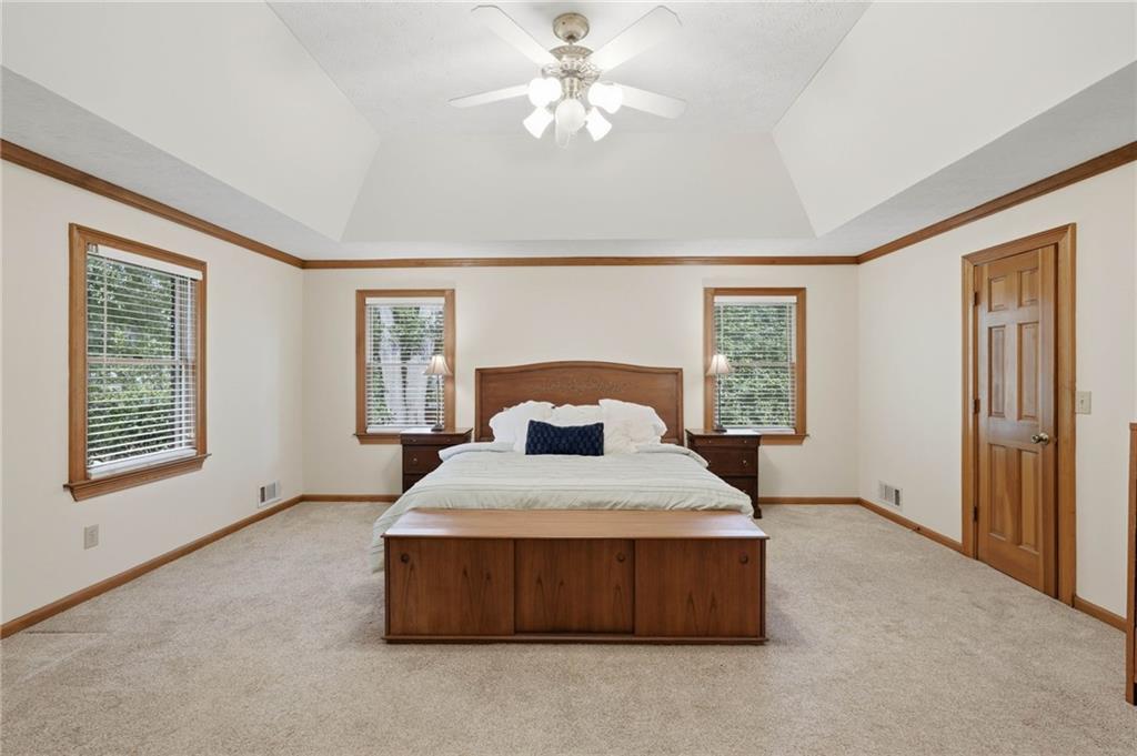 4891 Bill Cheek Road Auburn, GA 30011 - Photo 33 of 99 a living room with a bed furniture and a window