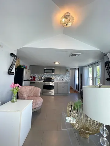 a living room with furniture and a window