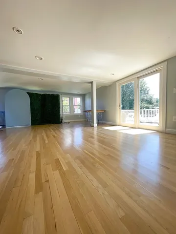 a large kitchen with a stove and refrigerator