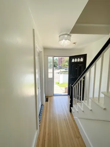 a view of entryway with wooden floor