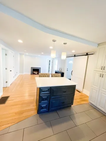a bathroom with a tub sink and shower