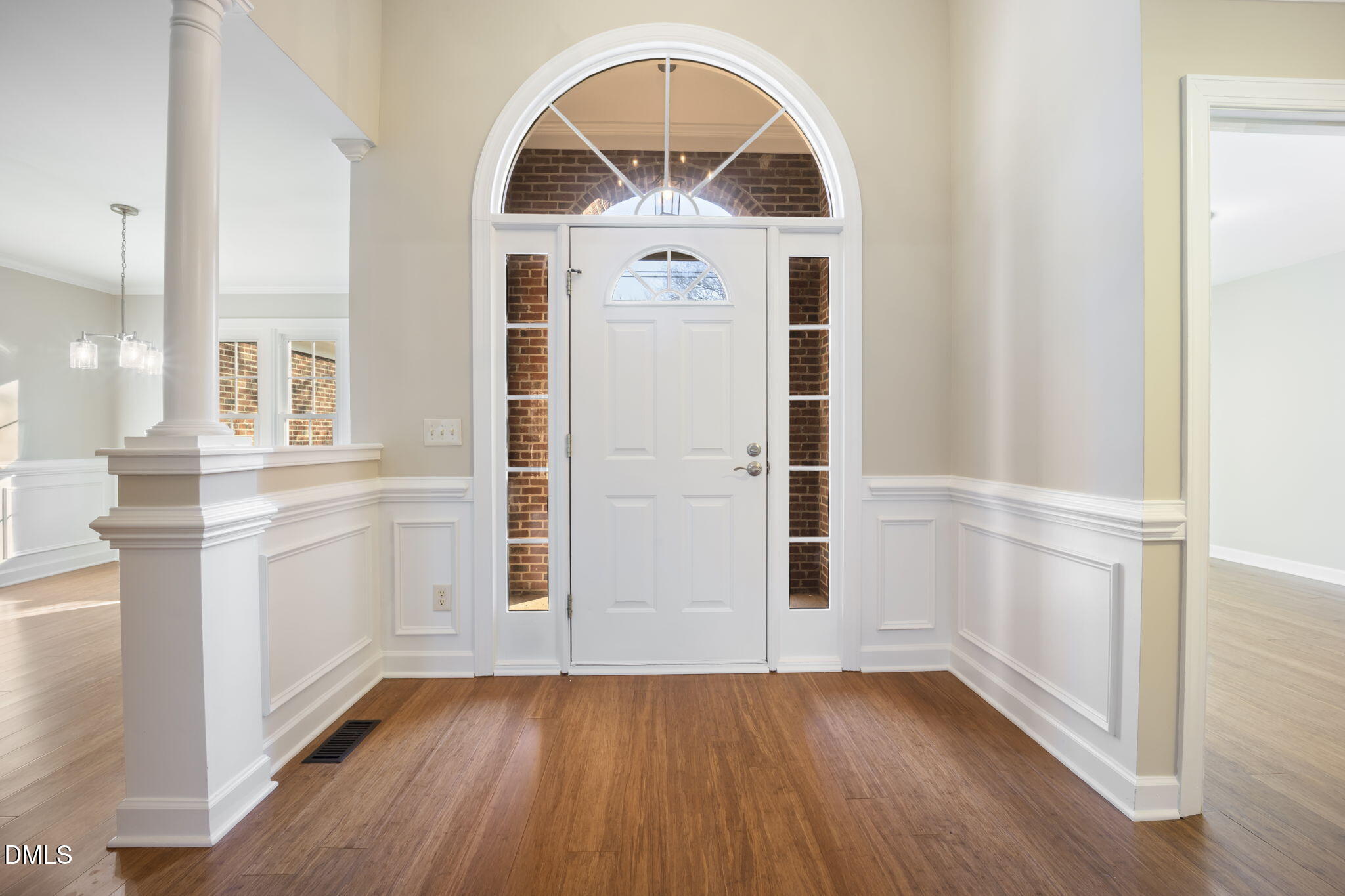 912 Broadhaven Drive Raleigh, NC 27603 - Photo 10 of 53 an empty room with wooden floor cabinet and windows