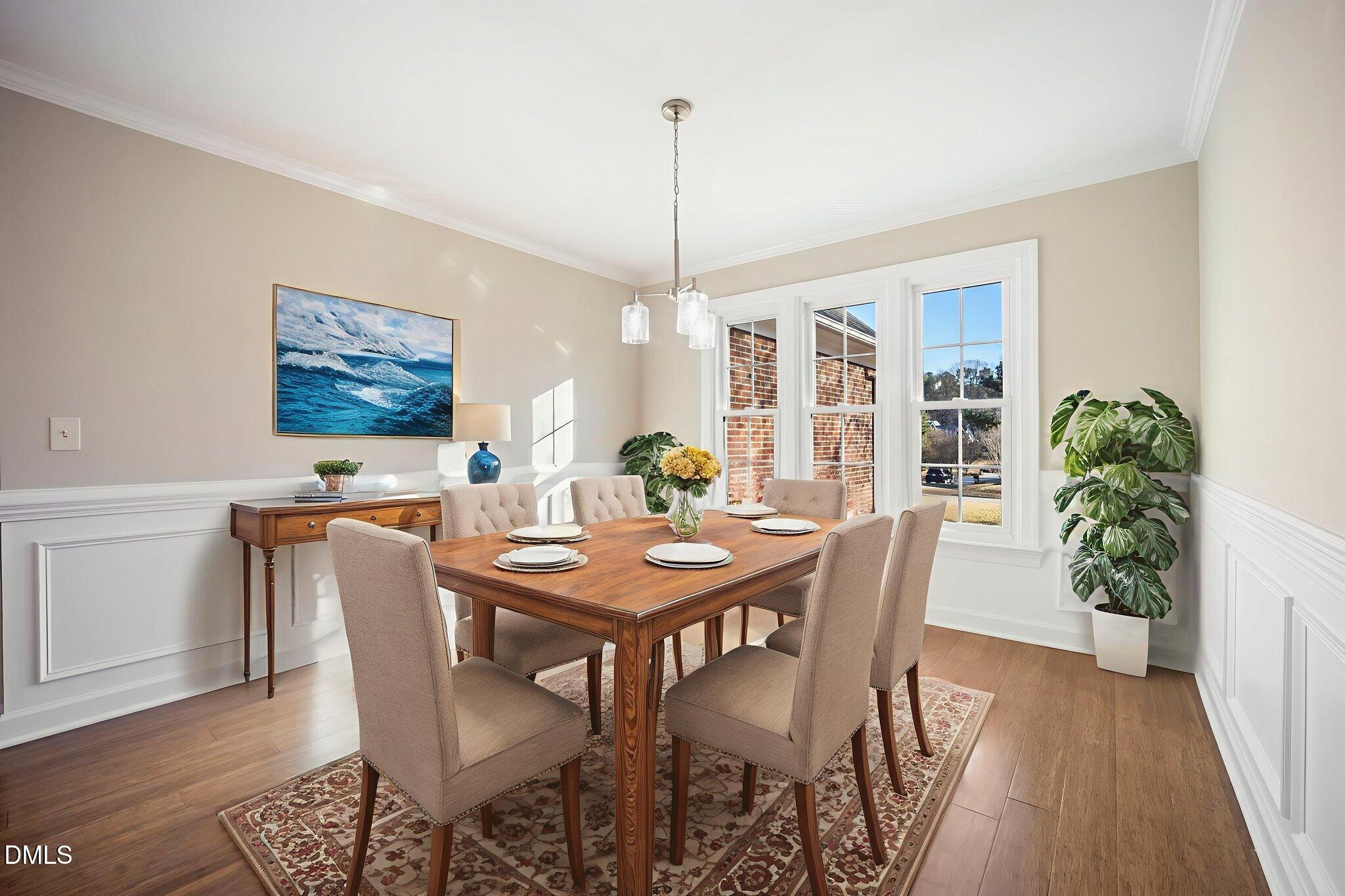912 Broadhaven Drive Raleigh, NC 27603 - Photo 16 of 53 a view of a dining room with furniture window and wooden floor