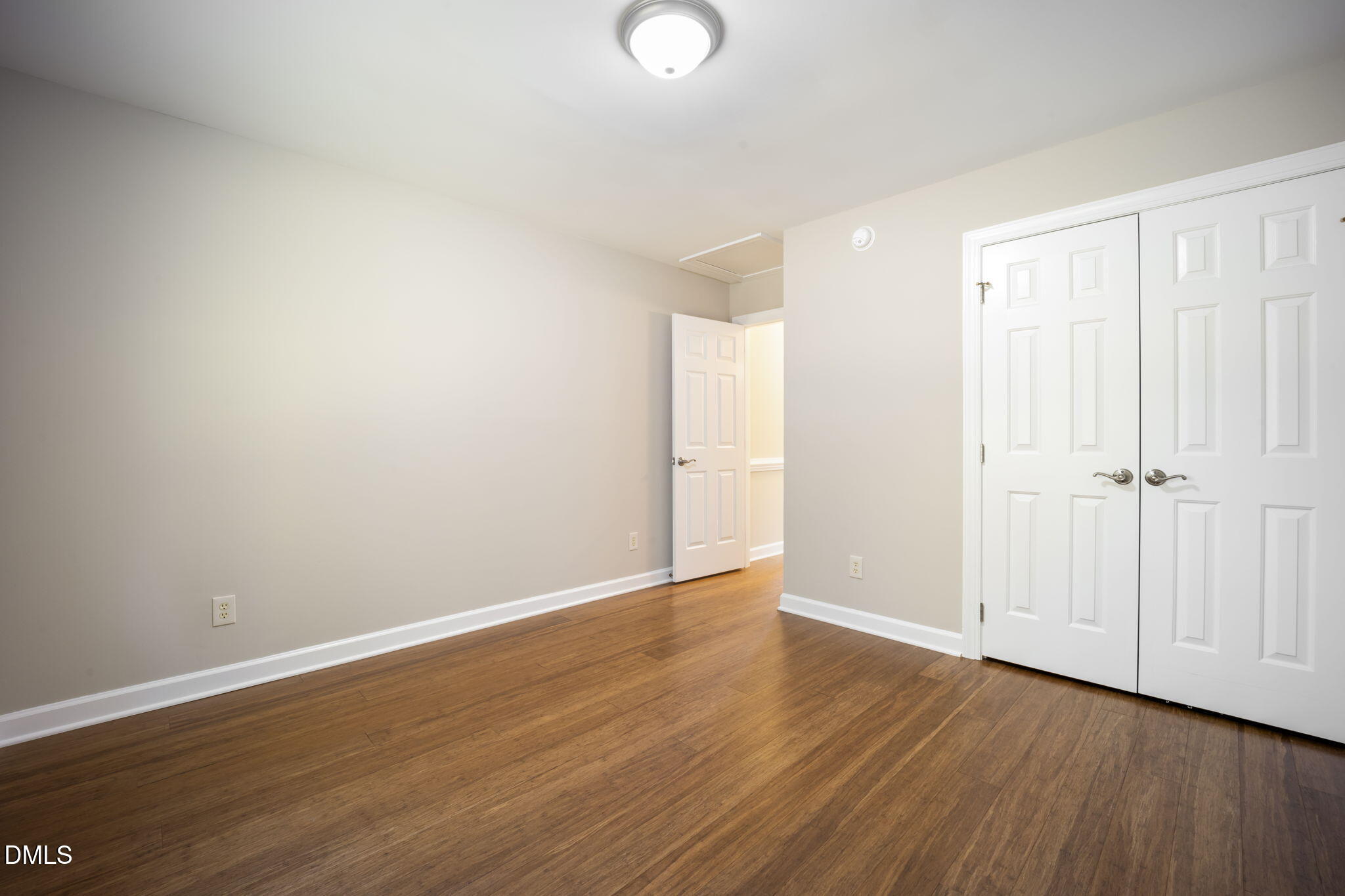 912 Broadhaven Drive Raleigh, NC 27603 - Photo 17 of 51 a view of an empty room with wooden floor