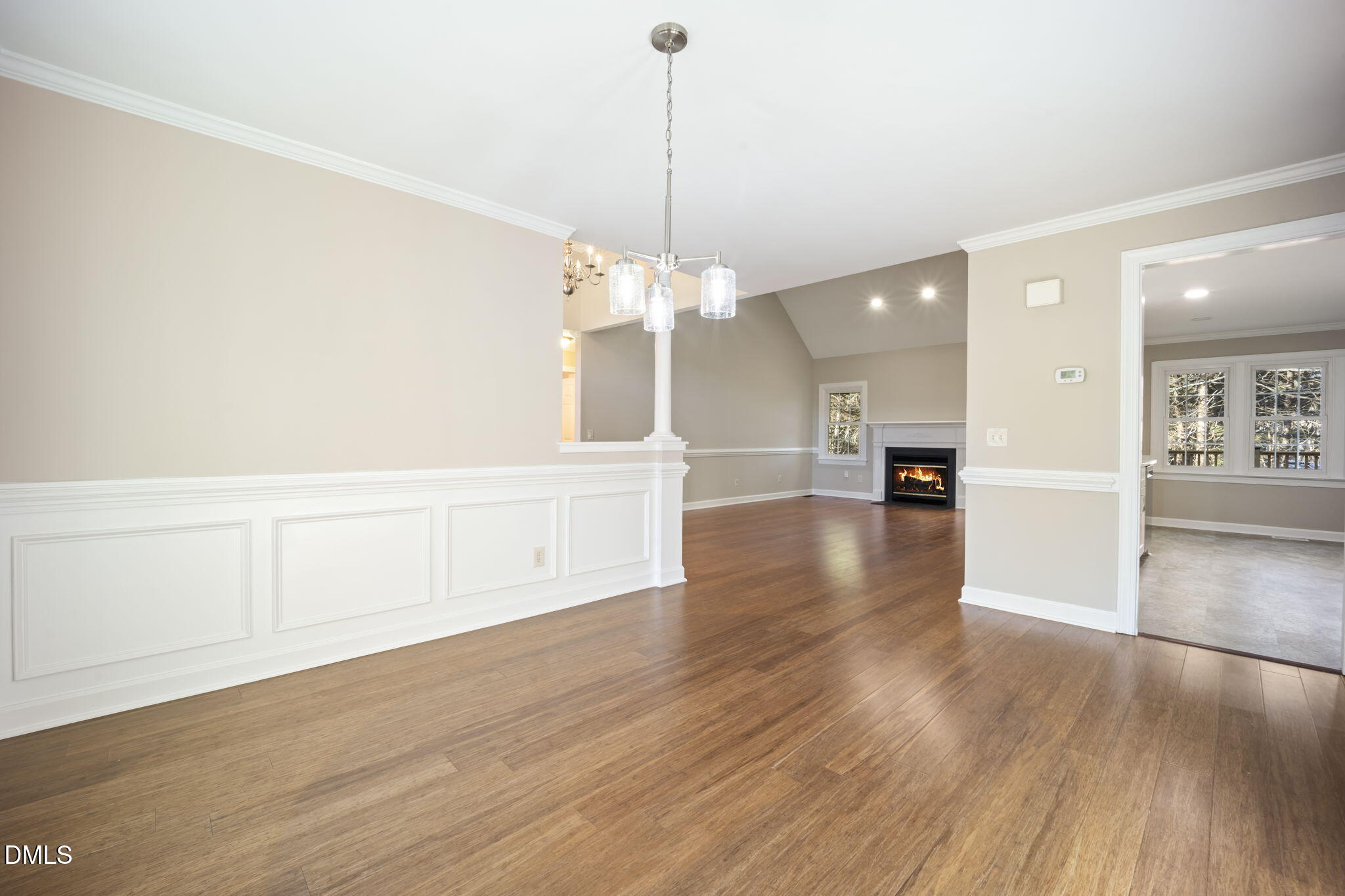 912 Broadhaven Drive Raleigh, NC 27603 - Photo 17 of 53 a view of a room with wooden floor and a chandelier