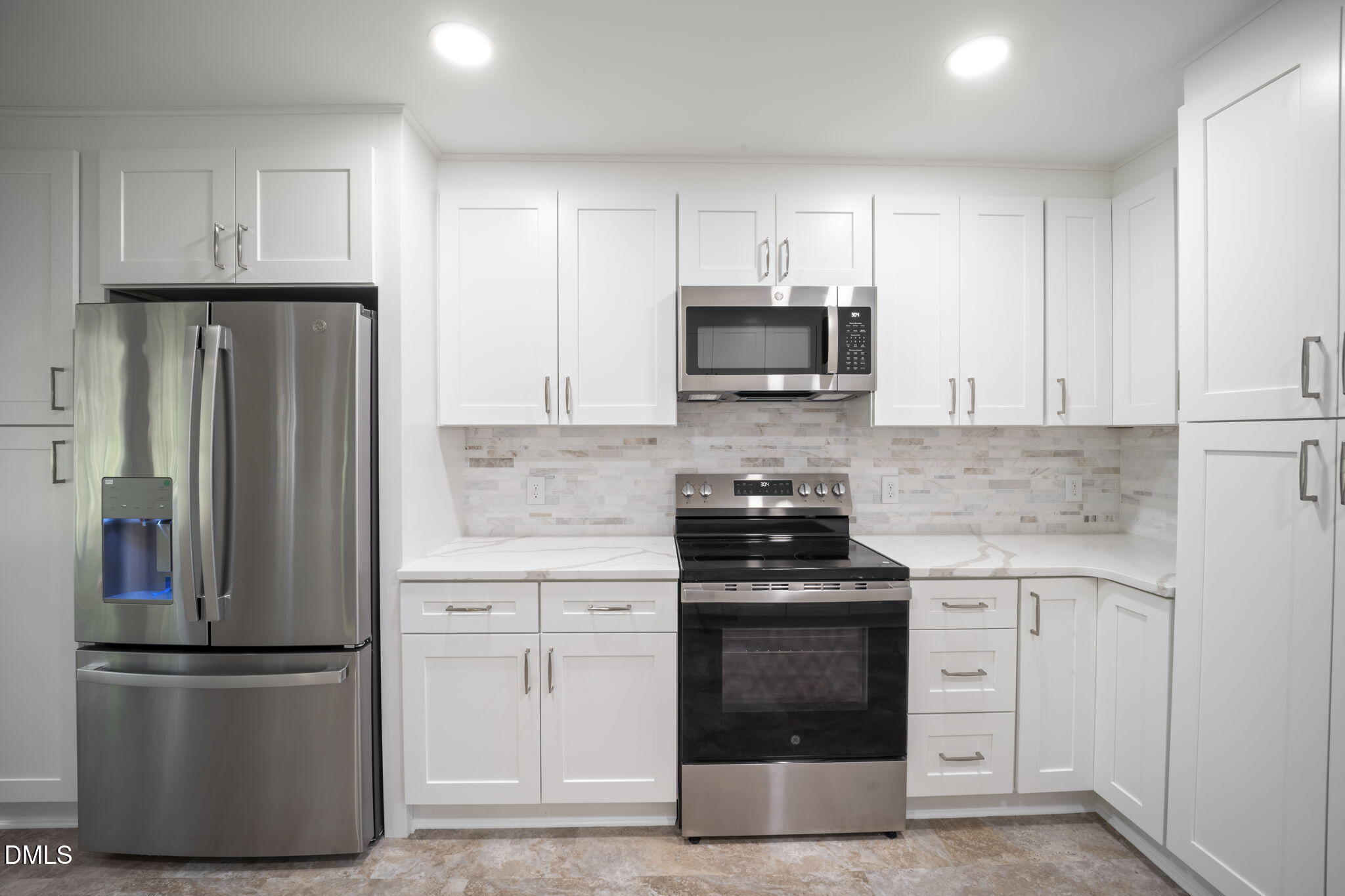 912 Broadhaven Drive Raleigh, NC 27603 - Photo 25 of 53 a kitchen with cabinets stainless steel appliances and a sink