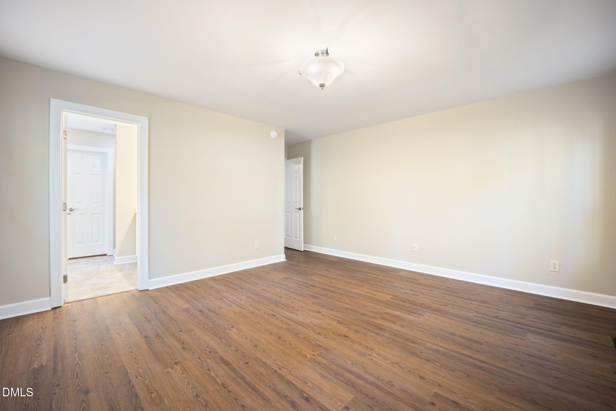 912 Broadhaven Drive Raleigh, NC 27603 - Photo 32 of 53 a view of an empty room with wooden floor