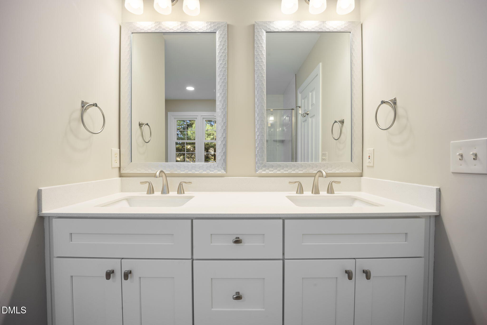 912 Broadhaven Drive Raleigh, NC 27603 - Photo 34 of 53 a bathroom with double sink and a mirror