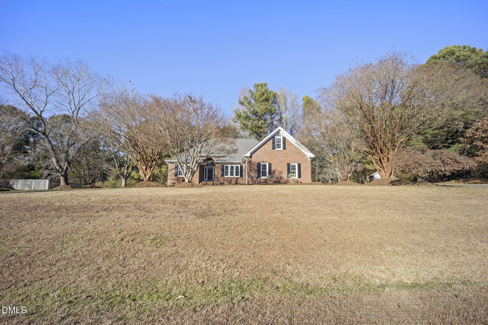 912 Broadhaven Drive Raleigh, NC 27603 - Photo 3 of 53 a front view of a house with a yard and trees