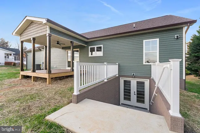 a view of a house with wooden fence