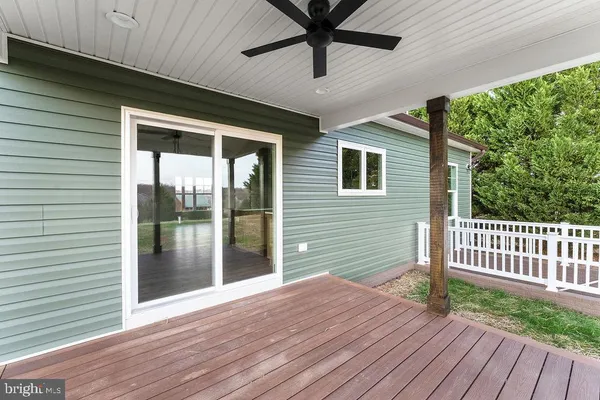 a view of backyard with deck and outdoor space