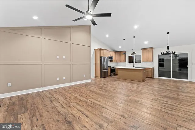 a view of a kitchen with a sink and a stove top oven