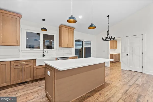 a kitchen with a sink a stove and a refrigerator
