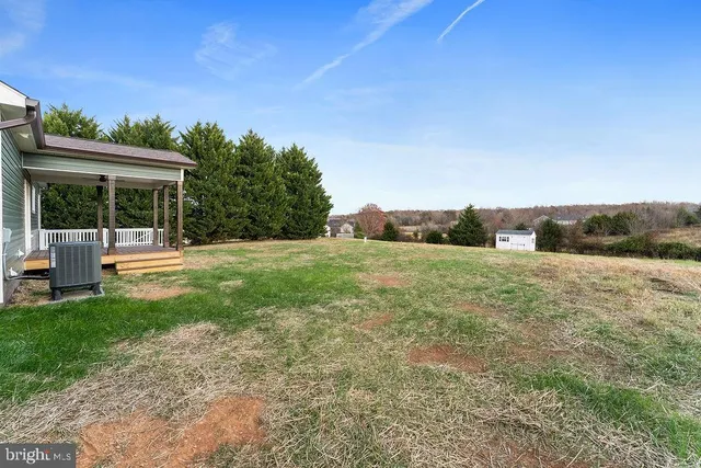 a view of a patio with a table and chairs