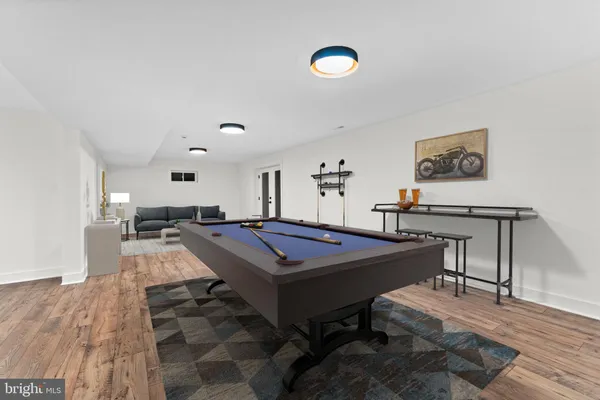 a room with furniture and pool table