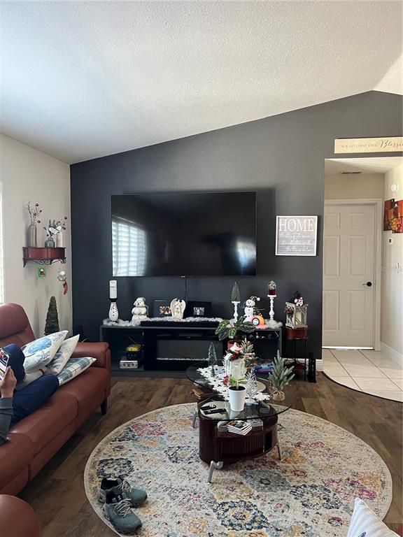 13834 Southwest 114th Avenue Dunnellon, FL 34432 - Photo 2 of 22 a living room with furniture and a chandelier