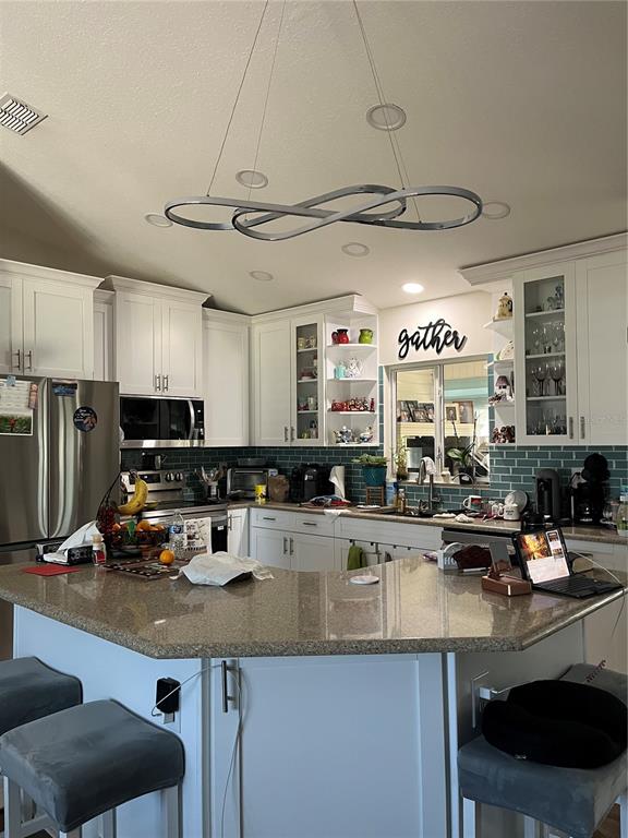 13834 Southwest 114th Avenue Dunnellon, FL 34432 - Photo 7 of 22 a kitchen with lots of counter space and a sink