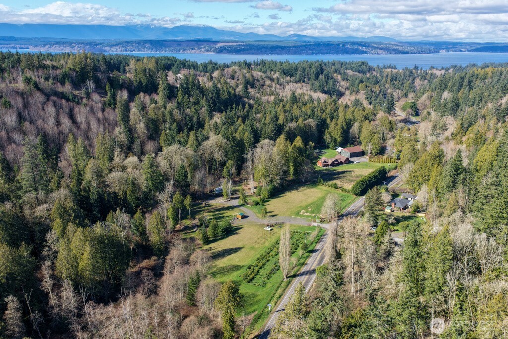 26663 Big Valley Road Northeast Poulsbo, WA 98370 - Photo 12 of 40 a view of a lake with a yard