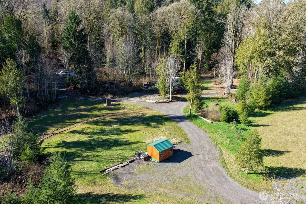 26663 Big Valley Road Northeast Poulsbo, WA 98370 - Photo 14 of 40 a view of a swimming pool with a yard