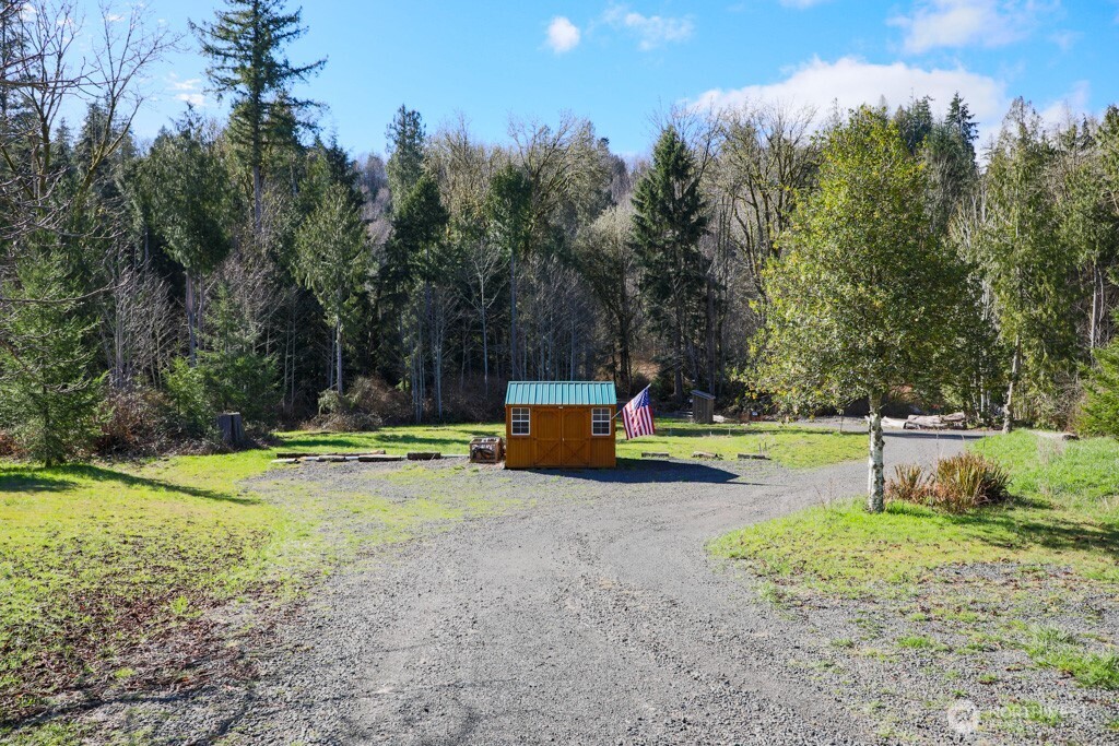 26663 Big Valley Road Northeast Poulsbo, WA 98370 - Photo 5 of 40 a view of a park with trees