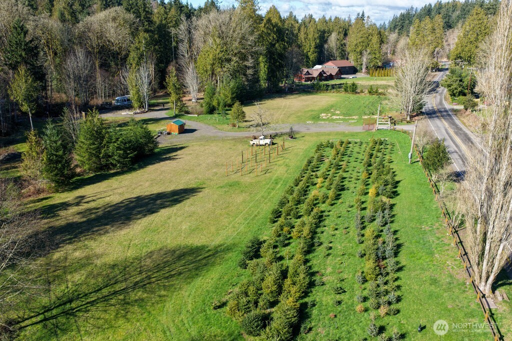 26663 Big Valley Road Northeast Poulsbo, WA 98370 - Photo 7 of 40 a view of a swimming pool with a garden