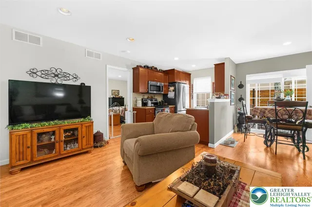 a bedroom with a bed and a television