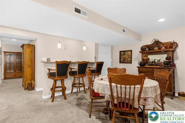 a view of dining room with furniture and wooden floor