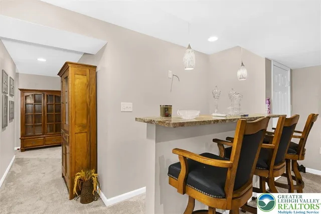 a view of a dining room with furniture and a livingroom