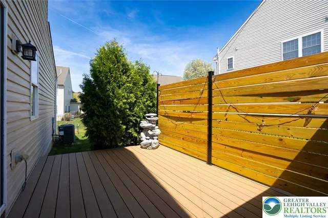 a view of a balcony with table and chairs