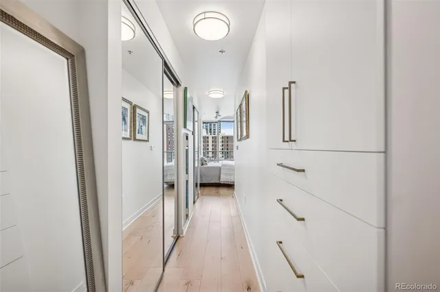 a bathroom with a toilet a sink a mirror a shower and a mirror