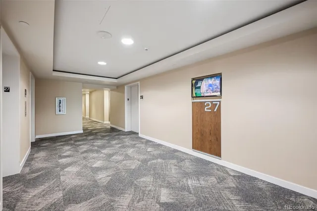 a view of a garage with parked cars
