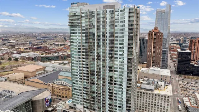 a view of swimming pool with outdoor seating and a potted plant