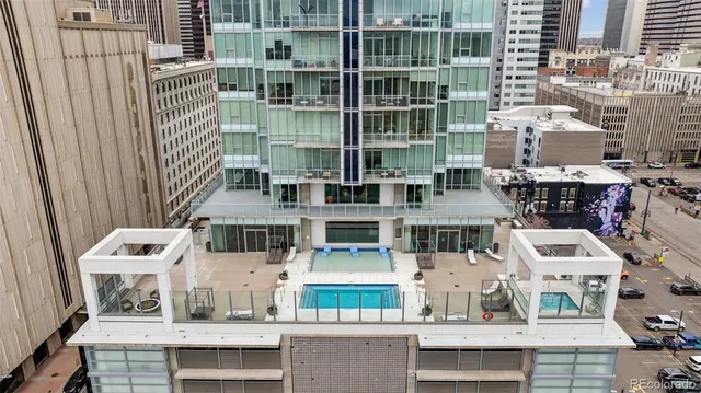 a dining room with furniture and a potted plant