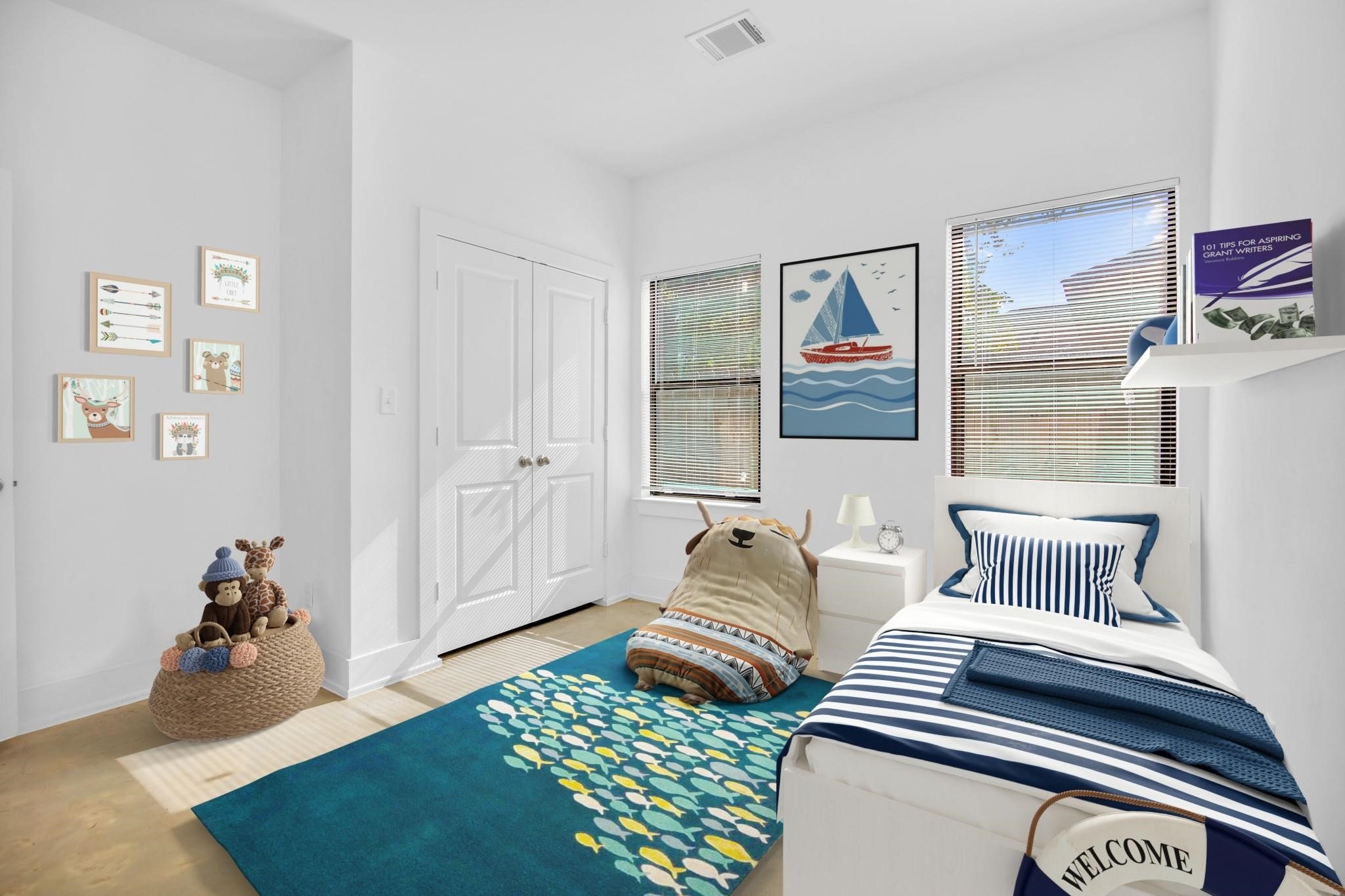 603 Edgewood Street, Unit B Houston, TX 77023 - Photo 11 of 16 a bedroom with furniture and wooden floor