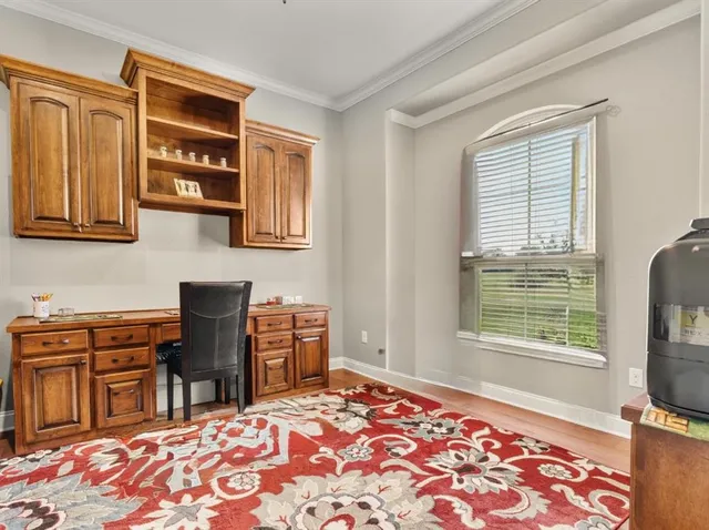 a bedroom with a bed closet and flat tv screen