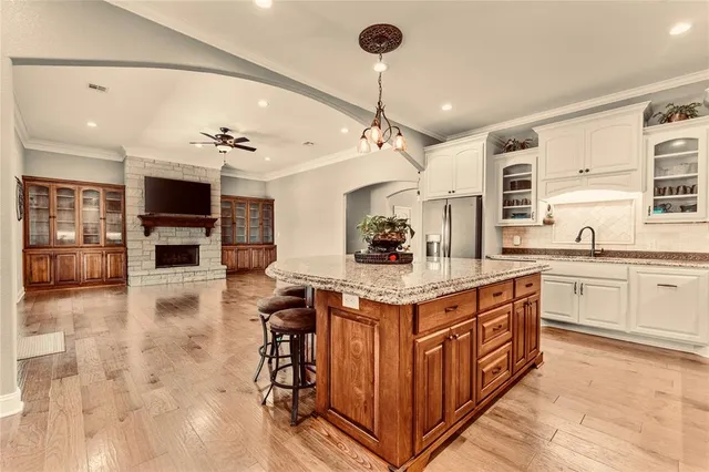 a kitchen with a stove a sink and a refrigerator