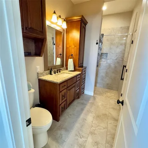 a view of a bathroom with a toilet sink and a window