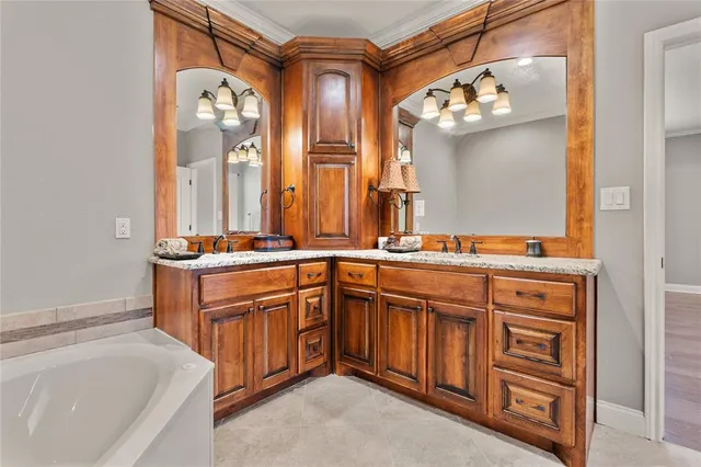 a bathroom with a sink and a large mirror