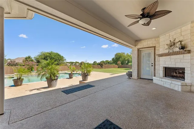 a view of a living room and a floor to ceiling window