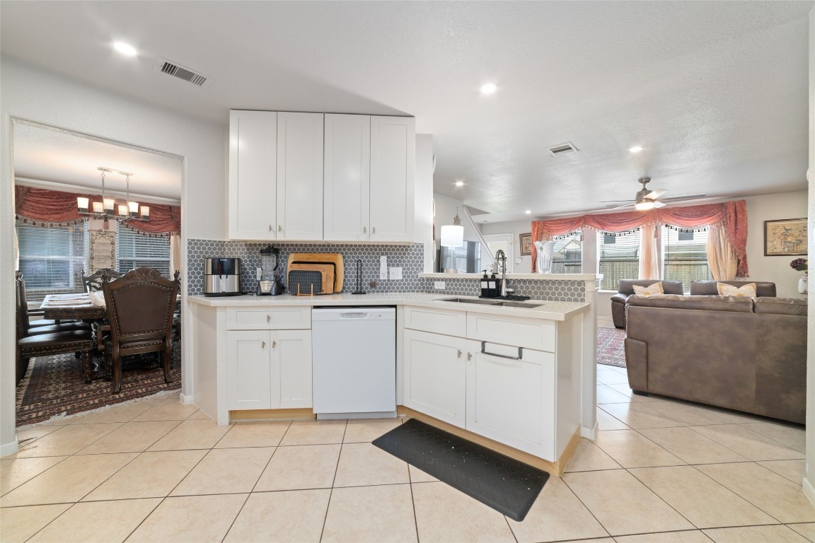 3038 Winchester Rnch Trail Katy, TX 77493 - Photo 12 of 29 a kitchen with cabinets and chairs